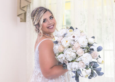 Gorgeous bride posing with flower bouquet